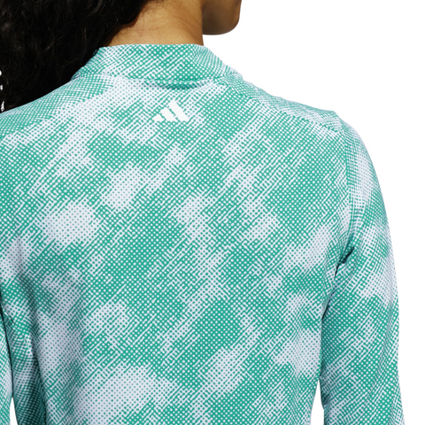A person is shown from the back wearing an Adidas Ultimate365 Printed Quarter-Zip Long-Sleeve Polo Shirt in Pure Teal, with the Adidas logo visible near the collar.
