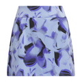 The Adidas Ultimate365 Womens Skort by Adidas is a high-waisted, A-line golf skort with a blue and black abstract floral pattern and a textured dotted effect on a light blue background.