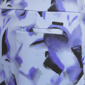 Close-up of the back pocket on the Adidas Ultimate365 Womens Skort by Adidas, showcasing its light blue, purple, and black abstract pattern with a sleek horizontal slit pocket—no button or flap—for a stylish golf look.