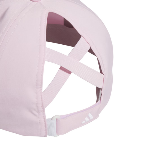 A close-up of the golf360nz Adidas Womens Crisscross Hat in Clear Pink, showing crisscross elastic bands, an adjustable strap with a white logo, and moisture-wicking fabric for lasting comfort.