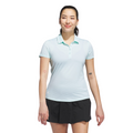 A woman with black hair in a ponytail, wearing the Adidas Womens Ottoman Short Sleeve Polo Shirt and a black skirt, stands against a white background. She has tattoos on both arms, smiles slightly, and stays comfortable with this breathable Adidas polo.