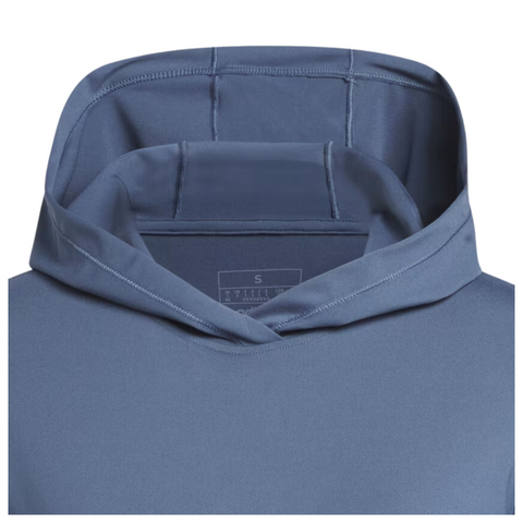 A close-up of the blue Adidas Women's Performance Golf Hoodie shows its soft stretch fabric, hood, and part of the chest with a visible size S tag inside the neckline.