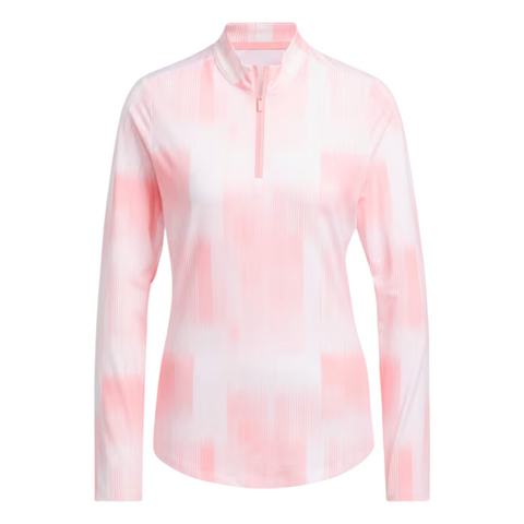 The Adidas Women’s Ultimate365 Long Sleeve Shirt features a high collar, fitted shape, quarter-zip, UV 50+ fabric, and a stylish white pink abstract pattern for sun protection.