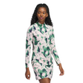 A woman with curly hair wears the Adidas Women's Ultimate365 Long Sleeve Shirt and a matching green and white abstract leaf print skirt, both made from UV 50+ fabric.