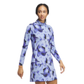 A woman stands against a white background, looking to the side, wearing the Adidas Women's Ultimate365 Long Sleeve Shirt featuring a blue and purple abstract pattern.