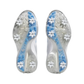 The image displays the bottom view of two Adidas Womens ZG23 Golf Shoes in White/Blue/Silver (US 7), featuring removable white cleats and light blue details on translucent soles, placed side by side on a white background.