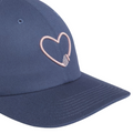 Close-up of a blue Adidas Golf Love hat featuring a pink embroidered heart-shaped golf tee on the front.