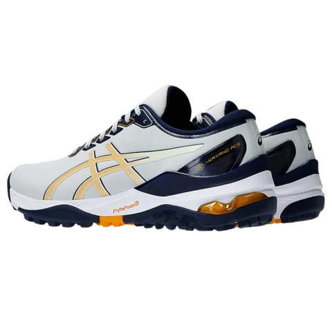A pair of white and navy Asics Gel Kayano Ace 2 Wide Men’s Golf Shoes with yellow accents, visible gel cushioning in the sole, and the Asics logo on the side.