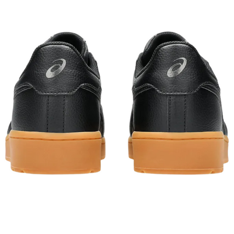 A pair of black Asics Japan S Men's Golf Shoes with light brown rubber soles, seen from the back with the Asics logo on each heel against a white background