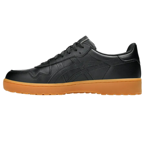 The Asics Japan S Men’s Golf Shoes feature a black leather design with matching black laces and a gum-colored spikeless sole, highlighted in a side profile