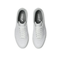 A pair of white Asics Japan S Mens Golf Shoes is shown from above, featuring white laces, perforated toe boxes, and dark gray insoles with the Asics logo. These spikeless sneakers are set against a plain white background.