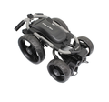 Compact, folded view of the Axglo Flip n Go Golf Trundler with visible 'Flip n Go' logo on the top panel and large wheels, showcasing its sleek black and gray design.