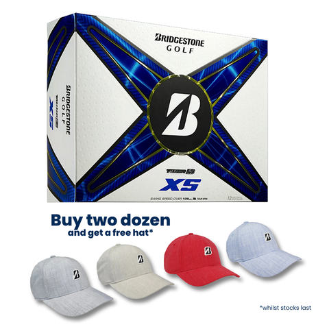 A box of Bridgestone 2024 Tour B XS MindSet Golf Balls sits above four Bridgestone hats in grey, light grey, red, and light blue. Text: Buy two dozen tour-level spin golf balls, get a free hat* *while stocks last.
