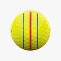 The Callaway 2025 ERC Soft Triple Track Golf Ball in yellow features bold red and blue alignment lines on its dimpled surface, displayed on a white background.