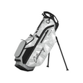 The Callaway 2025 Fairway+ Stand Bag features a white design with black palm leaf pattern and accents, built-in stand legs, and cart compatibility for versatile use—shown here against a plain white background.