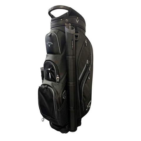 The black Callaway 2025 Forrester Cart Bag by Callaway features a 14-way top, multiple zippered pockets, mesh side panels, and a top handle, shown against a white background.