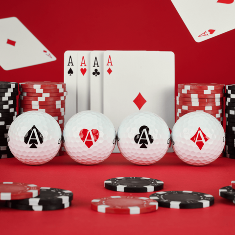 The Callaway 2025 Limited Edition Supersoft Aces Golf Balls feature four balls, each with a unique ace suit symbol, set against a red poker-themed backdrop—perfect for golfers seeking soft feel and exclusive style.