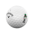 A white Callaway 2025 Supersoft golf ball from the 12-Day Advent Calendar features the Callaway logo and a cartoon golfer in green—an ideal holiday golf gift.
