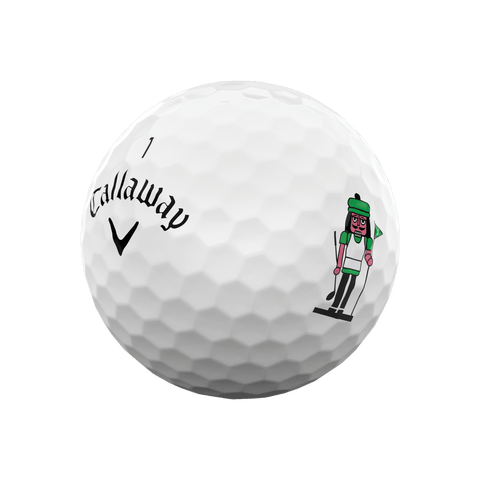 A white Callaway 2025 Supersoft golf ball from the 12-Day Advent Calendar features the Callaway logo and a cartoon golfer in green—an ideal holiday golf gift.
