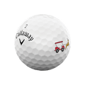 A white Callaway 2025 Supersoft golf ball with dimples, featuring a red and white golf cart towed by a reindeer—part of the Callaway 2025 Supersoft 12-Day Advent Calendar Golf Balls, an ideal holiday gift.