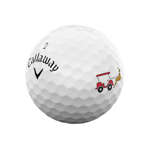 A white Callaway 2025 Supersoft golf ball with dimples, featuring a red and white golf cart towed by a reindeer—part of the Callaway 2025 Supersoft 12-Day Advent Calendar Golf Balls, an ideal holiday gift.