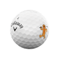 A white Callaway 2025 Supersoft golf ball, numbered 4, with a smiling gingerbread man illustration—part of the Callaway 12-Day Advent Calendar Golf Balls set—makes a perfect unique holiday gift for golfers.