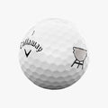 A limited edition Callaway 2025 Supersoft Grill Master golf ball in white, featuring a black logo and gray charcoal grill image, designed for a soft feel and standout style.