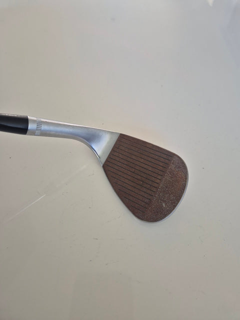 Callaway JAWS Raw 60 degree wedge face with natural rust and lightly used grooves