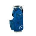 A blue Callaway ORG 14 HD Cart Bag 2025 with a palm leaf pattern, multiple zippered pockets, and sturdy handle is shown against a white background. This waterproof golf bag from Callaway is stylish and practical.
