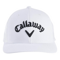 The Callaway Performance Pro Hat is a white golf hat featuring black Callaway embroidery and a chevron logo, offering moisture-wicking comfort on the course.