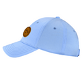 The Callaway Women’s Heritage Twill Golf Cap features a light blue design, curved brim, side round brown Callaway logo patch, stitched eyelets and details, sun protection, and an adjustable fit.