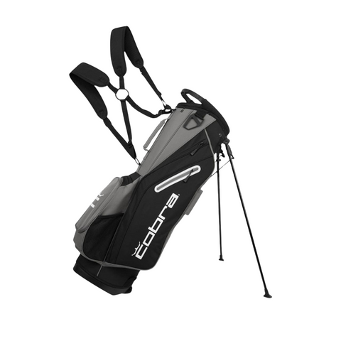 The golf360nz Cobra 2025 Signature Stand Bag in Black/Grey features dual shoulder straps, two extended stand legs, and a lightweight design with the Cobra logo displayed on the side pocket.