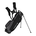 The Cobra 2025 Ultralite Carry Bag in Black/Dusky Grey features dual shoulder straps, multiple pockets, two extended support legs, and the Cobra logo for comfortable carrying on the course.