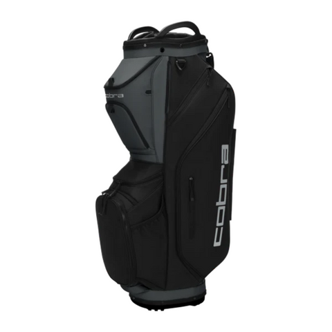 The Cobra 2025 Ultralite Pro Cart Bag in Black/Dusky Grey features multiple zippered compartments, a 14-way top design, and displays the Cobra brand name in large white letters on the side.