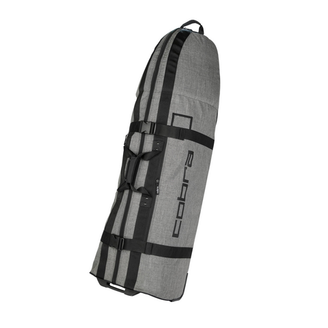 The Cobra Crown Rolling Club Travel Cover by Cobra is a large grey and black golf travel bag with cobra printed on the side. It features sturdy black straps and handles, and it stands upright at an angle against a white background.