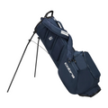 The Cobra Ultralite Pro Stand Bag 2025 by Cobra is shown in navy blue with dual shoulder straps, side pockets, and two extended legs for support. This lightweight golf bag combines style and convenience, displayed at an angle on a white background.