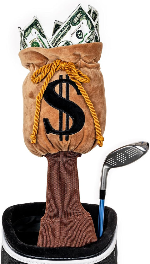 A golf bag holds a driver with a Daphnes Animal Golf Headcover and a brown club headcover shaped like a money bag with a dollar sign, stuffed with imitation dollar bills.