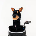 A golf bag displays a club with a Daphnes Animal Golf Headcover by Daphne, shaped like a black and brown Doberman dog, beside an uncovered club on a white background—ideal for fans of animal-themed golf accessories.