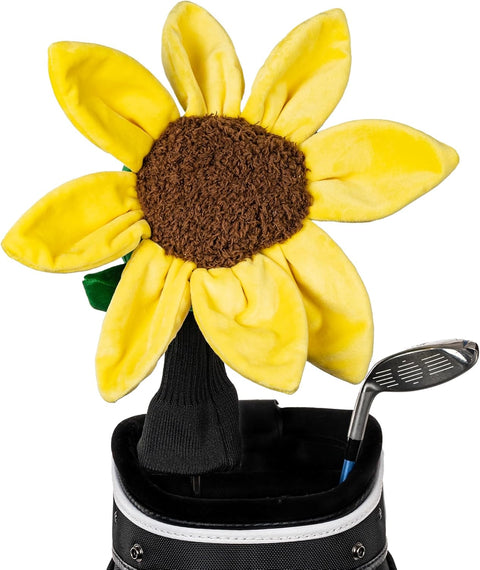 A plush sunflower headcover from Daphne’s Animal Golf Headcovers by Daphne, featuring yellow petals and a brown center, sits in a golf bag beside a club, bringing cheerful charm to your headcover collection.
