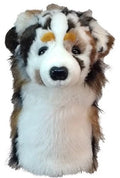A plush dog-shaped golf headcover by Daphne, featuring white, brown, black, and gray fur, a fluffy body, dark eyes, and a black nose—just like the adorable designs from Daphnes Animal Golf Headcovers.