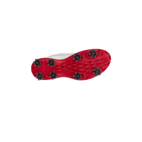 This image displays the underside of ECCO Biom Tour Womens Golf Shoes, featuring a white design with a vivid red sole, eight black traction cleats, and the Ecco logo near the heel—showcasing these stylish waterproof golf shoes.