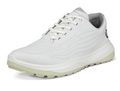 The Ecco Womens LT1 Golf Shoes in white feature a textured sole for grip, white laces, and a subtle gray lining—shown angled from the front and side—making them perfect lightweight golf shoes.