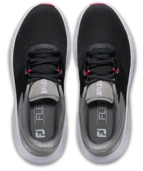 A pair of FootJoy 2023 Women's Flex Golf Shoes in black, seen from above with white soles, gray tongues, and pink accents. Insoles show FLEX and the FJ logo, representing the FootJoy brand.