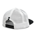 The FootJoy 2025 Shaka Glove Trucker Hat in black/white is a breathable mesh-back cap, shown from the rear with an adjustable snapback closure and a small black tag with a white FootJoy logo on the left side.