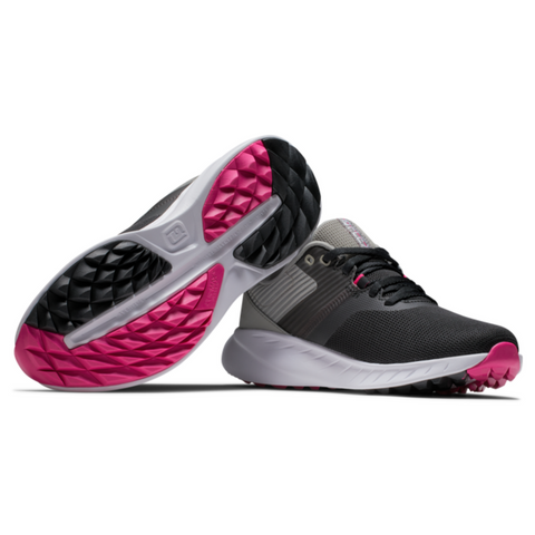 The FootJoy Flex Women’s Golf Shoes by FootJoy feature black uppers, gray accents, and white soles for a sporty look. Textured treads with black and bright pink sections deliver excellent grip and eye-catching style.