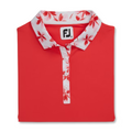 A folded FootJoy Floral Trim Short Sleeve Womens Polo in red features a white collar, placket with red floral pattern, white buttons, open collar design, and the FJ logo on the inside label.