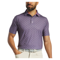 A man in a purple patterned FootJoy Flying Wasp Men’s Lisle Polo, beige pants, and a grey belt stands with one hand on his hip against a white background. This FootJoy golf polo offers moisture-wicking fabric for comfort.