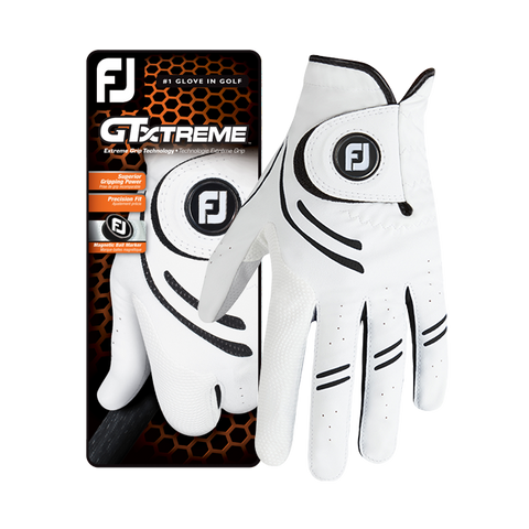 A pair of FootJoy GTxtreme Men's Golf Gloves in white with black accents is shown next to its branded packaging, featuring a high-tech grip for lasting performance.