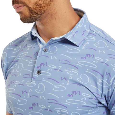 Close-up of the FootJoy Golf Doodle Polo in storm blue, featuring an abstract doodle pattern in white and purple. The shot focuses on the collar and upper chest, highlighting the button-up design and smooth fabric texture.