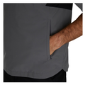 A person wearing a gray FootJoy HydroLite X Short Sleeve Rain Shirt places their right hand in its zippered pocket. Only the lower torso and arm are visible.